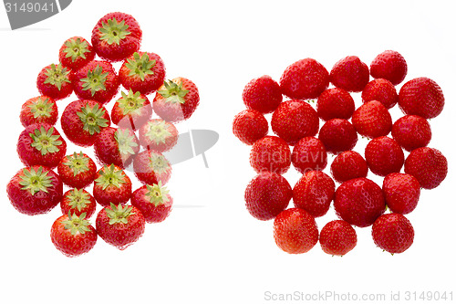Image of Strawberries Arranged In Two Groups Over White
