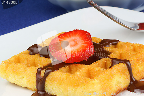 Image of Waffle with strawberry and chocolate sauce