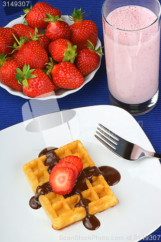 Image of Waffle with strawberry and chocolate and a milkshake