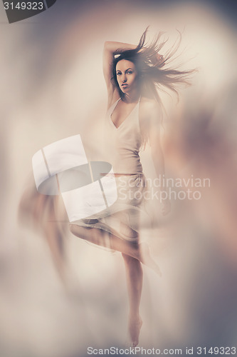 Image of Fine art photo of woman in white dress