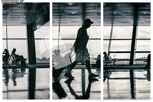 Image of Silhouette of man at the airport with luggage