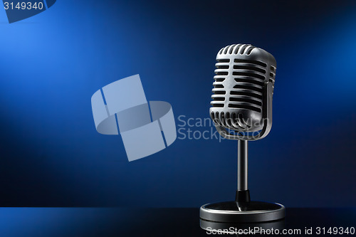 Image of Retro microphone on blue