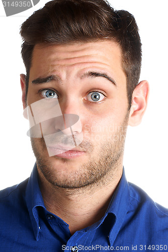 Image of Young man making a funny face over a white background