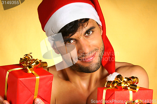 Image of Sexy Santa Claus with presents