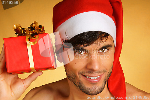 Image of Sexy Santa Claus with present