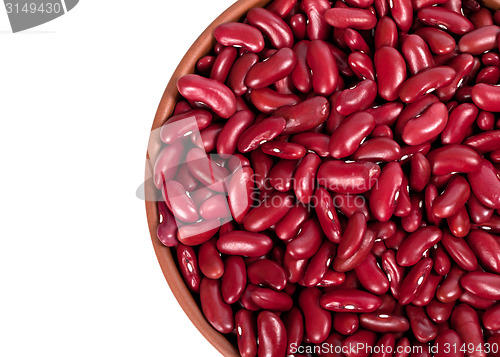 Image of Red haricot in ceramic bowl. Top view.