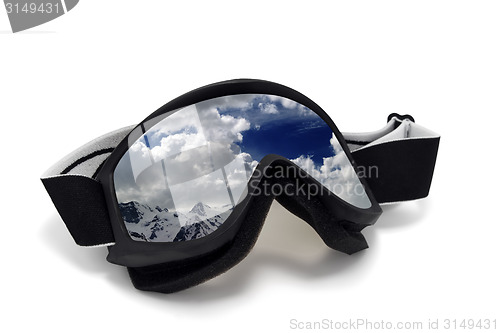 Image of Ski goggles with reflection of cloudy mountains