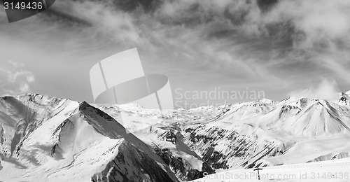 Image of Black and white panorama of winter snowy mountains