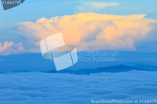 Image of sea of fog with forests as foreground