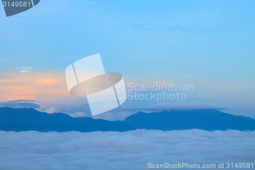 Image of sea of fog with forests as foreground