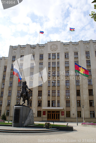 Image of Man horseback and building