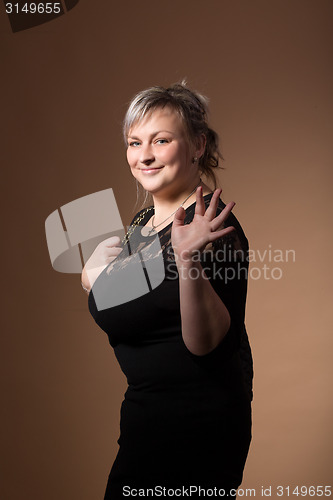 Image of portrait of beautiful plus size curly young blond woman