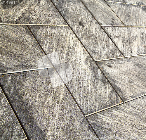 Image of near mozzate street  pavement of a curch and wall marble