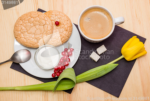 Image of Cup of coffee and biscuits