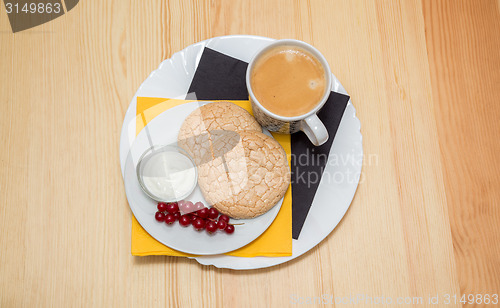 Image of Cup of coffee and biscuits