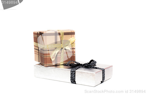 Image of brown and silver gift box with bow on white background