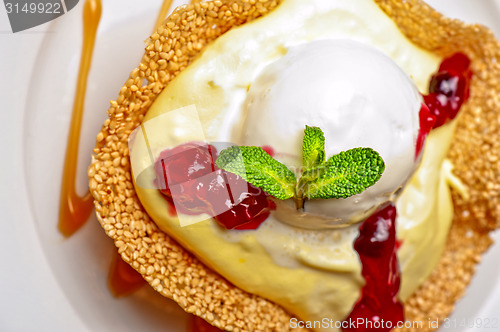 Image of cake with jam ice cream