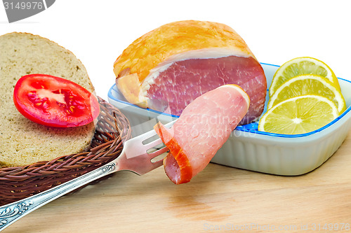 Image of Ham , bread and vegetables on a white background.