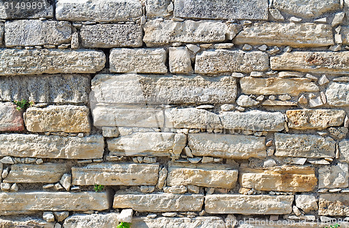 Image of Fragment of an ancient wall from stones. (Background image)