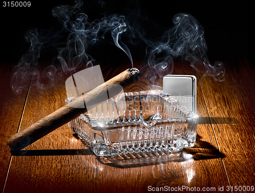 Image of Cigar and lighter