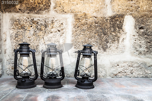 Image of Three old lanterns in Santa Catalina monastery