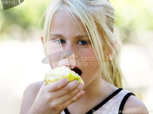 Image of Girl eating apple