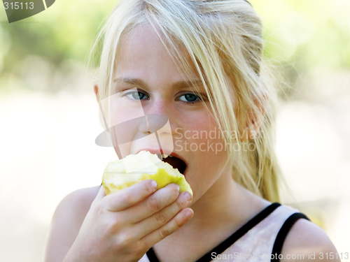 Image of Girl eating apple
