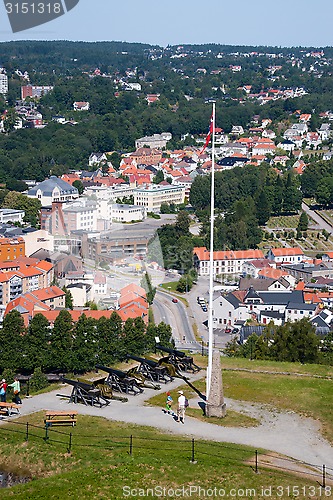 Image of FREDRIKSTEN, NORWAY - JULY 21, 2013: Visitors looking at cannons