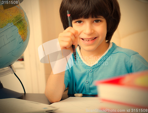 Image of schoolboy doing homework