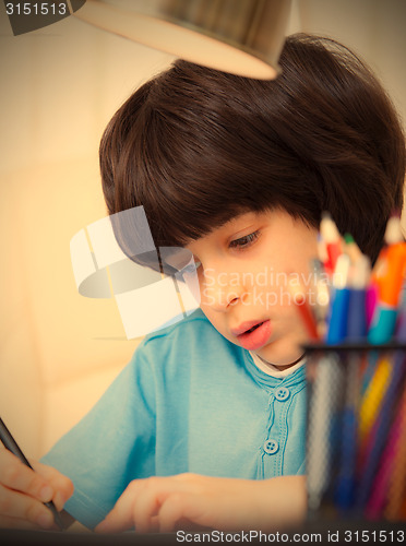 Image of Boy doing homework, portrait