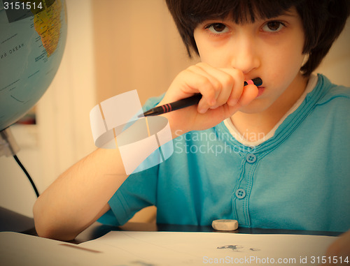 Image of boy doing homework