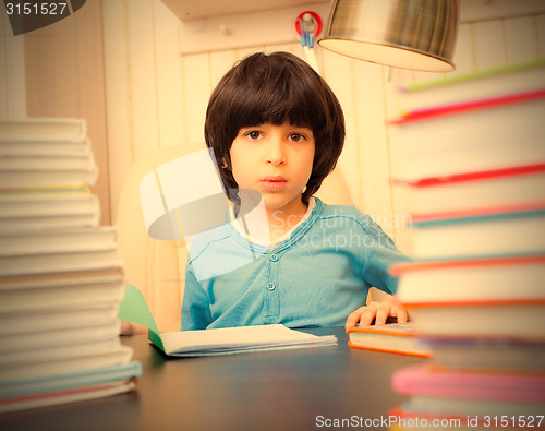 Image of boy reading a book