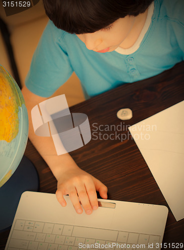 Image of boy doing homework