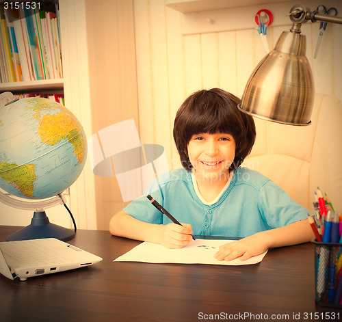 Image of schoolboy doing homework