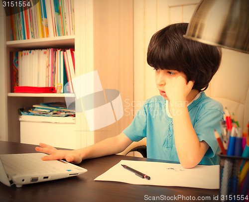 Image of boy doing homework