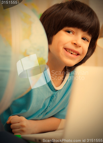 Image of boy on a geography lesson