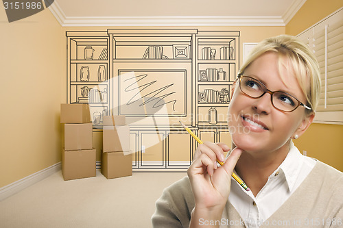 Image of Daydreaming Woman Holding Pencil In Rom with Shelf Drawing on Wa