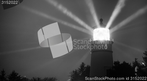 Image of Lighthouse Beams From Lens Rainy Night Pillars of Light