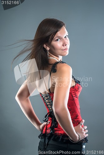 Image of young attractive woman in red corset