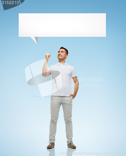 Image of smiling man pointing finger up to text bubble