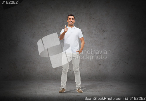 Image of smiling man showing thumbs up