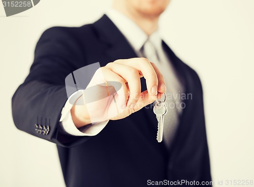 Image of man holding house keys