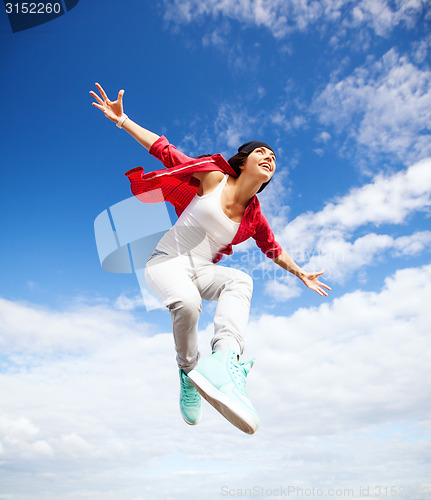 Image of beautiful dancing girl jumping