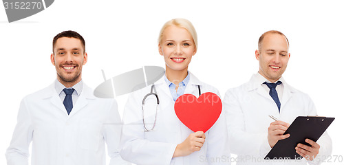 Image of group of smiling doctors with red heart shape