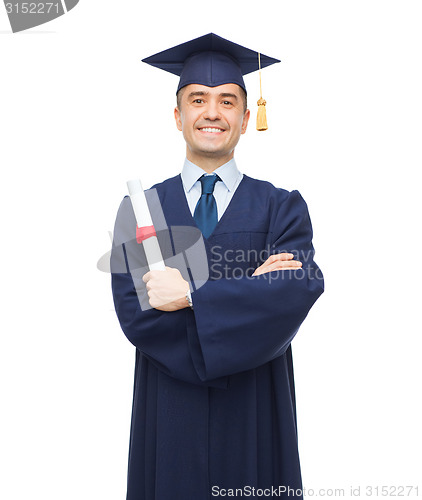 Image of smiling adult student in mortarboard with diploma