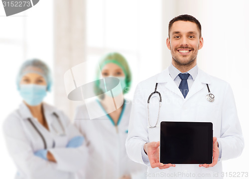 Image of smiling male doctor with tablet pc