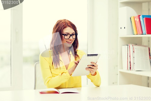 Image of student with tablet pc computer and notebook