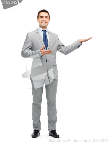Image of happy smiling businessman in suit