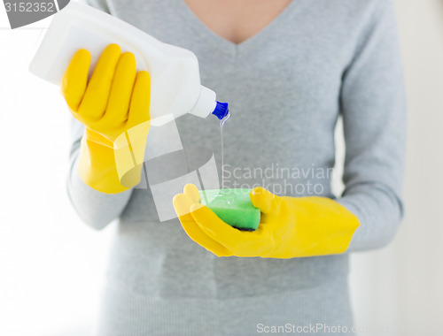 Image of close up of woman with sponge and cleanser