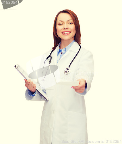 Image of smiling female doctor with clipboard